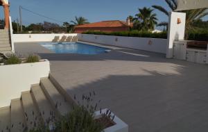 a patio with a swimming pool in a house at Villa Martí in Calpe