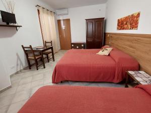 Postel nebo postele na pokoji v ubytování Cloris Guest House