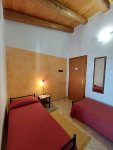 Postel nebo postele na pokoji v ubytování Cloris Guest House