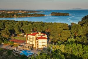 an aerial view of a house and the water at Premantura Resort - Hotel & Restaurant in Premantura