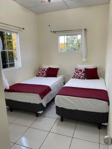 Ένα ή περισσότερα κρεβάτια σε δωμάτιο στο A 5 minutos de las Ruinas del Tazumal, Chalchuapa Santa Ana El Salvador