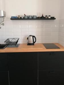 a tea kettle sitting on a counter in a kitchen at APARTMANI GOMILA in Jelsa