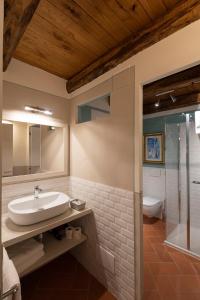 a bathroom with a sink and a shower at Il Palazzo - Agriturismo, Winery in Arezzo