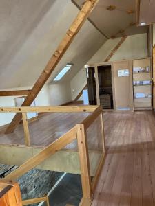 a loft bed frame being constructed in a attic at Traumscheune mit Pool, Kamin und privatem Spa in Linnich +33 photos