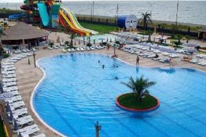 a large swimming pool at a beach with a water park at House in Gonio-Kvariati economy class in Kvariati