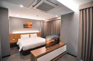 The S Block Condotel客房内的一张或多张床位