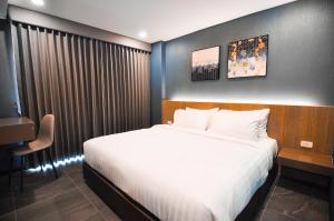 The S Block Condotel客房内的一张或多张床位