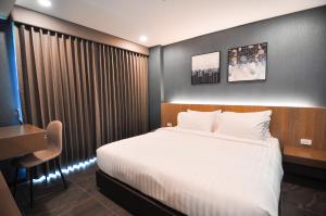 The S Block Condotel客房内的一张或多张床位