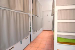 a hallway with bunk beds in a room at Tarifa Kite Hostel in Tarifa