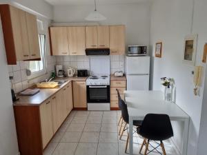 A kitchen or kitchenette at Likehome Apartments