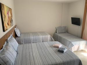 Cama ou camas em um quarto em Suíte 1015 - Thermas Place com Parque Aquático