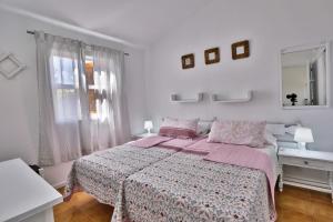 A bed or beds in a room at Bungalow Santa Fe de 2 habitaciones