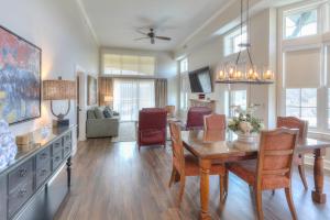 a dining room and living room with a table and chairs at RiverStone Condo Resort & Spa in Pigeon Forge