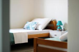 Postel nebo postele na pokoji v ubytování Apartman Cicibella