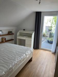 Łóżko lub łóżka w pokoju w obiekcie Gästewohnung Lipperland