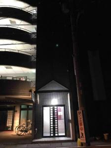 a building with a light on the side of it at night at Jinpachi Building - Vacation STAY 63997v in Gifu