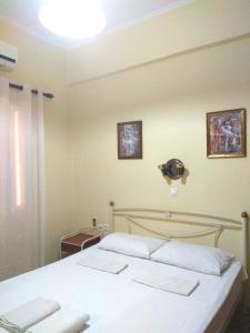 Giường trong phòng chung tại OLEA Apartments