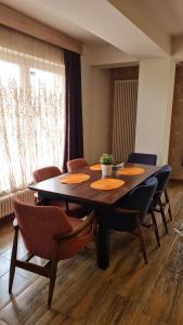 a dining room with a table and chairs at Villa Sarajevo Heights ex Villa Kolonija in Sarajevo