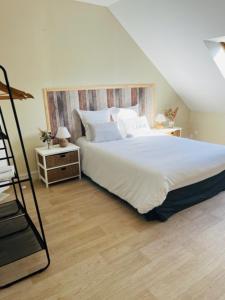 Ένα ή περισσότερα κρεβάτια σε δωμάτιο στο Appartement Entre ville et nature