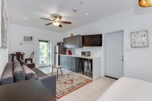 a living room with a couch and a kitchen at Modern Riverview Apartments in Fort Lauderdale