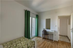 Postel nebo postele na pokoji v ubytování Apartman Krstičević