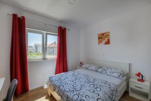 Postel nebo postele na pokoji v ubytování Apartman Krstičević