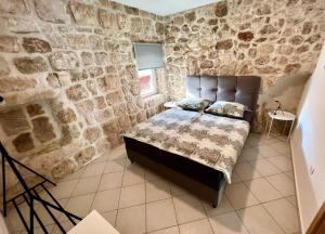 Posteľ alebo postele v izbe v ubytovaní Apartments Toni - Slano