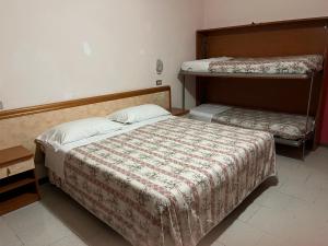 Postel nebo postele na pokoji v ubytování HOTEL ZUCCONI