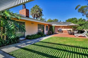 a house with a lawn in front of it at East Valley Manor in Montecito