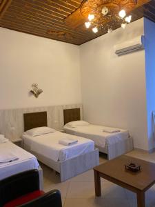 A bed or beds in a room at Kompleksi Jakaj