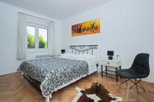 Posteľ alebo postele v izbe v ubytovaní Apartman MAMI-KROK