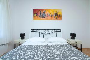 Posteľ alebo postele v izbe v ubytovaní Apartman MAMI-KROK