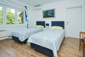 Posteľ alebo postele v izbe v ubytovaní Apartman MAMI-KROK