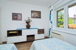 Posteľ alebo postele v izbe v ubytovaní Apartman MAMI-KROK
