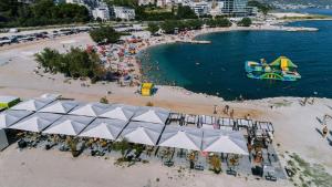 an aerial view of a beach with a boat in the water at Apartments Viking - In The OLD TOWN of SPLIT in Split
