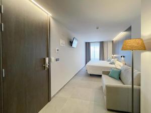Posezení v ubytování Hotel Quatre Llunes