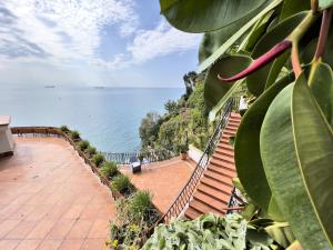 a view of the ocean from the balcony of a house at Due Relais - Panoramic Sea View Suites in Vietri