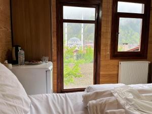 A bed or beds in a room at CERRAHPAŞA SUİTE HOTEL