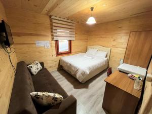A bed or beds in a room at CERRAHPAŞA SUİTE HOTEL