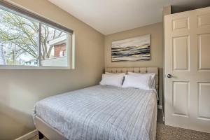 a bedroom with a bed and a window at Waterfront Syracuse Home with Patio and Fire Pit! in Syracuse