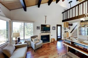 a living room with a couch and a fireplace at Ski Bowl Condos Unit 518 in Truckee