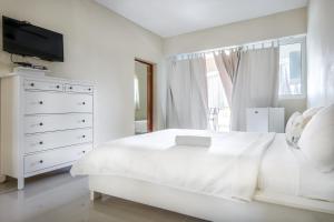 Voodi või voodid majutusasutuse Bella Vida Hotel Punta Cana toas
