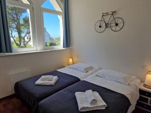 Posteľ alebo postele v izbe v ubytovaní Flat in Primel with Sea View & Beaches Nearby