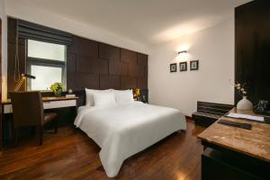 Voodi või voodid majutusasutuse La Nueva Boutique Hotel Hanoi & Spa toas