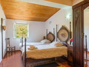 A bed or beds in a room at Country Farmhouse in Montemor o Novo with Swimming Pool