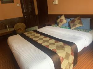 Postel nebo postele na pokoji v ubytování Hotel Payal
