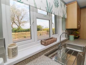 a kitchen with a sink and a window at The Bungalow in Newcastle upon Tyne