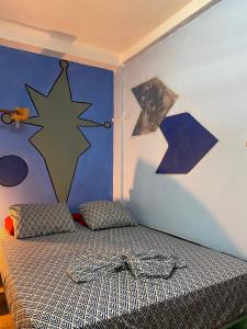 Ein Bett oder Betten in einem Zimmer der Unterkunft Zebulo Hostel