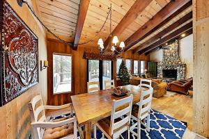 a dining room with a wooden table and chairs at Northstar Home in Truckee