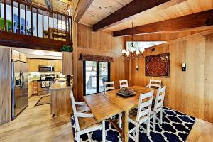 a kitchen and dining room with a wooden table and chairs at Northstar Home in Truckee